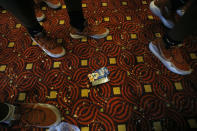 Members of the Texas Longhorns football team walk past an empty box of Frosted Flakes Saturday Sept. 7, 2019 at the team hotel in Austin, Tx. ( Photo by Edward A. Ornelas )