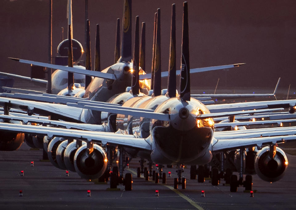 FILE --Lufthansa aircraft are parked on a runway at the airport in Frankfurt, Germany, Sunday, March 15, 2020. (AP Photo/Michael Probst,file)