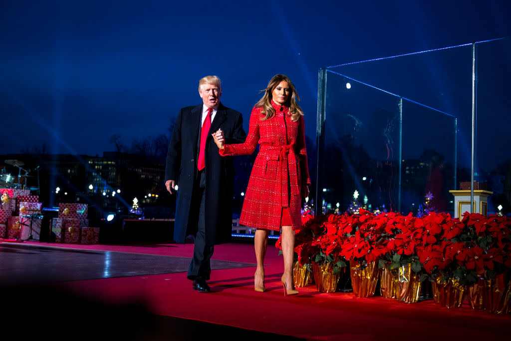 President Donald Trump and first lady Melania Trump held hands at the Christmas tree lighting. (Photo: Getty Images)