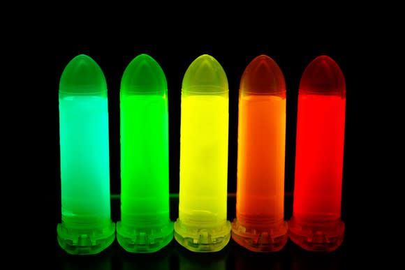 Quantum dot solutions tuned to various colors in test tubes.