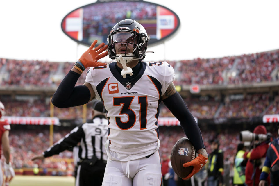 Denver Broncos safety Justin Simmons celebrates after intercepting a pass during the first half of an NFL football game against the Kansas City Chiefs Sunday, Jan. 1, 2023, in Kansas City, Mo. (AP Photo/Ed Zurga)