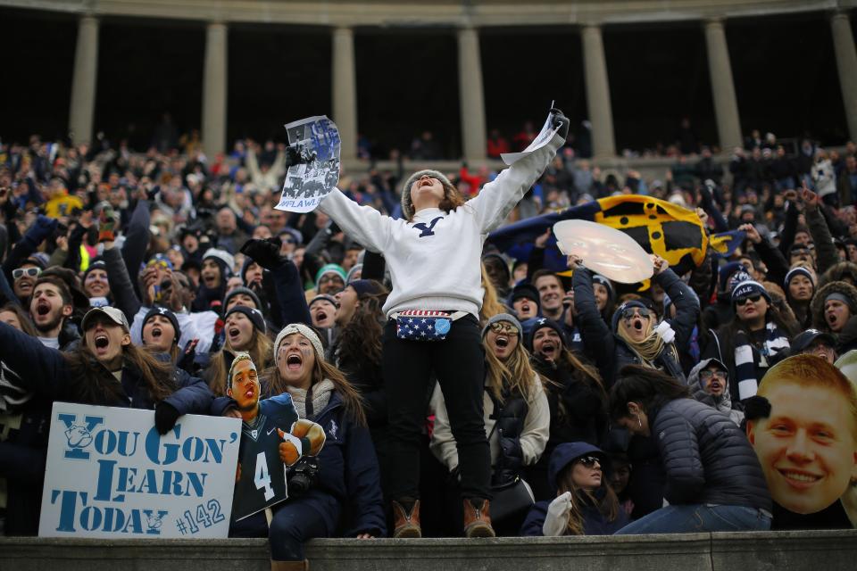 Yale University fans cheer during the football game against Harvard University at Harvard in Cambridge, Massachusetts November 22, 2014. Known as "The Game," the first Harvard versus Yale football game was played in 1875, making it one of the oldest rivalries in college sports. REUTERS/Brian Snyder (UNITED STATES - Tags: EDUCATION SPORT FOOTBALL)