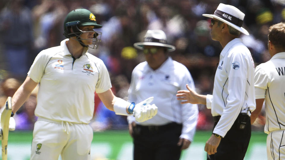 Australia's Steve Smith speaks with umpire Nigel Llong on the first day of the second cricket Test match against New Zealand at the MCG in Melbourne on December 26, 2019.  (Photo by WILLIAM WEST/AFP via Getty Images)