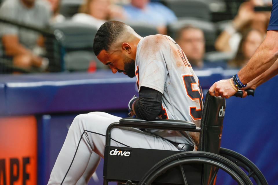 Detroit Tigers' Derek Hill is wheeled off the field during the fifth inning of a baseball game against the Tampa Bay Rays  Saturday, Sept. 18, 2021, in St. Petersburg, Florida.