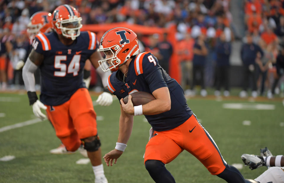 Sept. 2, 2023; Champaign; Illinois Fighting Illini quarterback Luke Altmyer (9) runs with the ball during the first half against the Toledo Rockets at Memorial Stadium. Ron Johnson-USA TODAY Sports