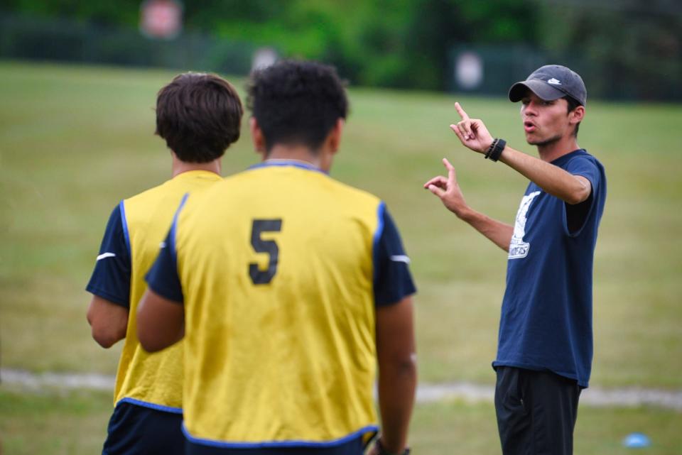 New Sussex County CC men's soccer coach Christian Castro-Pereira, 22, advises his players during their practice at their soccer field in Newton, Sunday on 09/05/22.