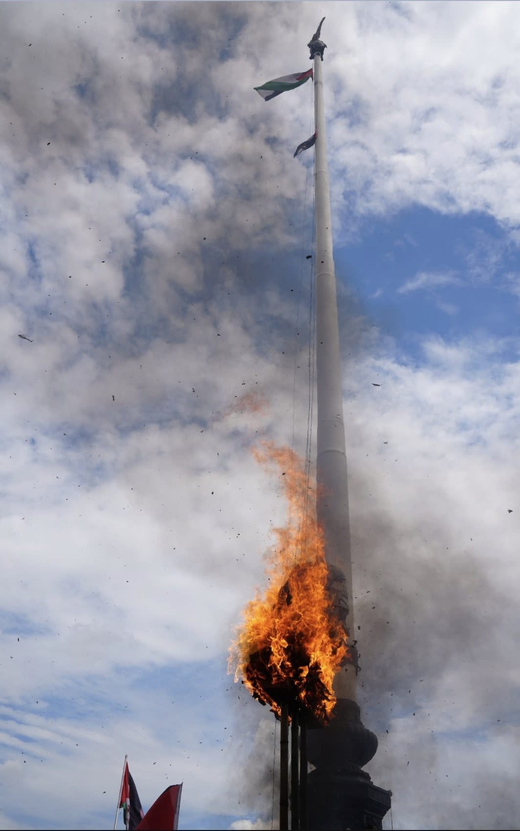 Demonstrators removed the US flag from the pole outside the station and burned it