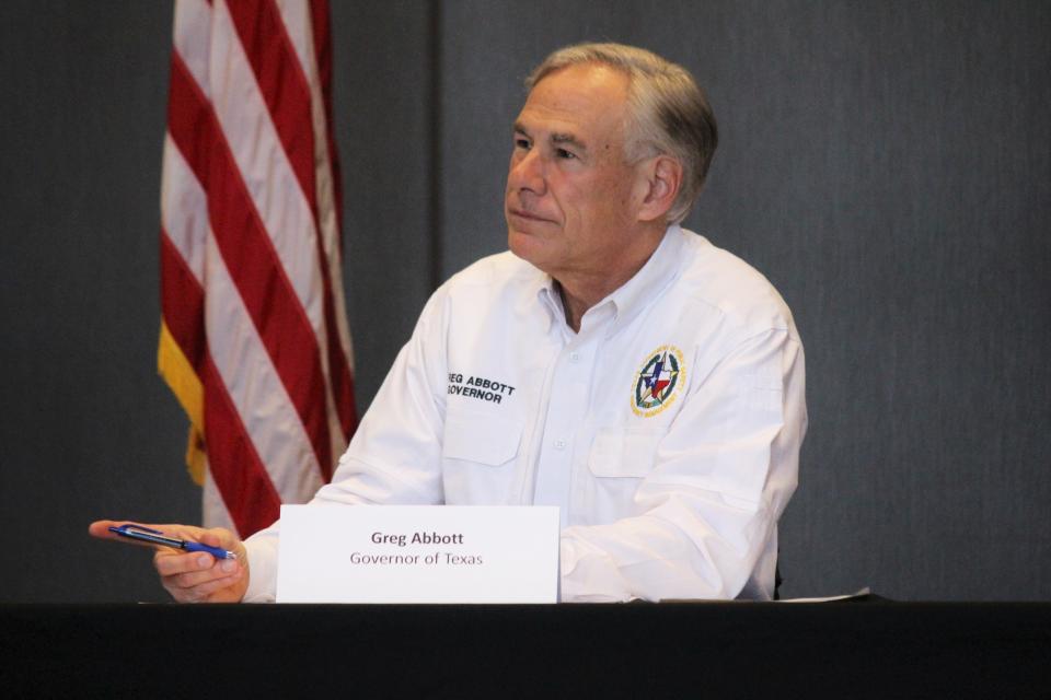 Texas Gov. Greg Abbott receives a briefing from local and state emergency management officials as fires rage across the Texas Panhandle, Friday, March 1, 2024, in Borger.