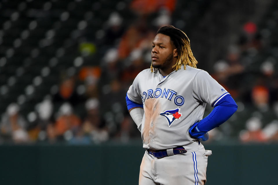 BALTIMORE, MD - JUNE 13: Vladimir Guerrero Jr. #27 of the Toronto Blue Jays looks on during a break in play against the Baltimore Orioles at Oriole Park at Camden Yards on June 13, 2019 in Baltimore, Maryland. (Photo by Will Newton/Getty Images)