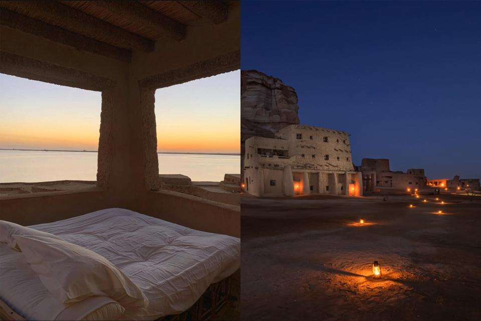 A bed and the exterior at night of Adrère Amellal Ecolodge