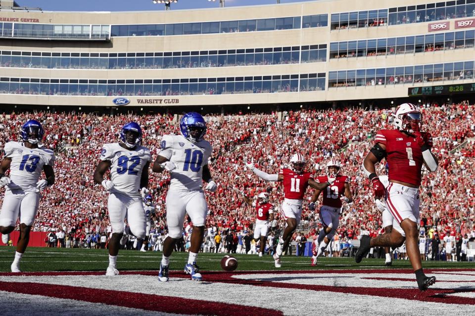 Wisconsin's Chez Mellusi (1) runs for a touchdown during the second half of an NCAA college football game against Buffalo Saturday, Sept. 2, 2023, in Madison, Wis. (AP Photo/Morry Gash)