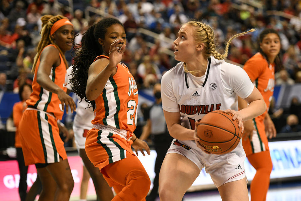 Louisville guard Hailey Van Lith makes a move against Miami guard Kelsey Marshall during the ACC tournament quarterfinal on March 4, 2022. (William Howard/USA TODAY Sports)