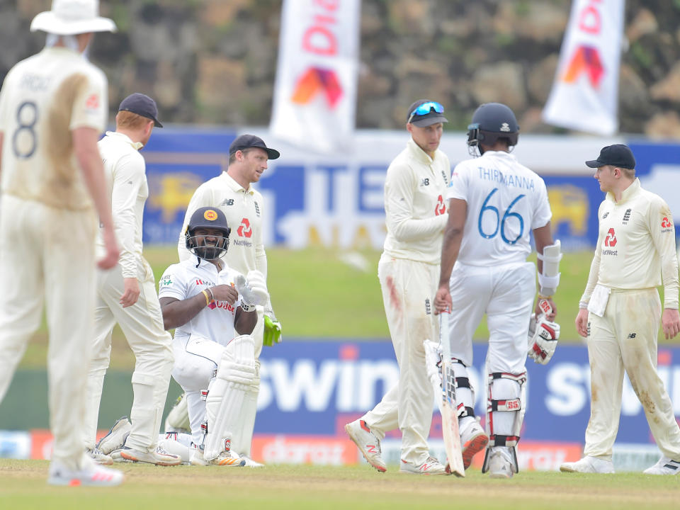 Kusal Perera suffers after being hit on the hand.jpg (ECB)