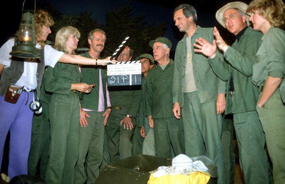 The last episode of MASH,’Goodbye, Farewell and Amen’. ‘Goodbye, Farewell and Amen’ remained the most watched television broadcast in American history. From second left: Loretta Swit, Mike Farrell, David Ogden Stiers, Jamie Farr, Harry Morgan, Alan Alda, William Christopher and Judy Farrell at Fox Ranch, June 18, 1984 at the Malibu Creek State Park in California (Photo by Paul Harris/Getty Images )