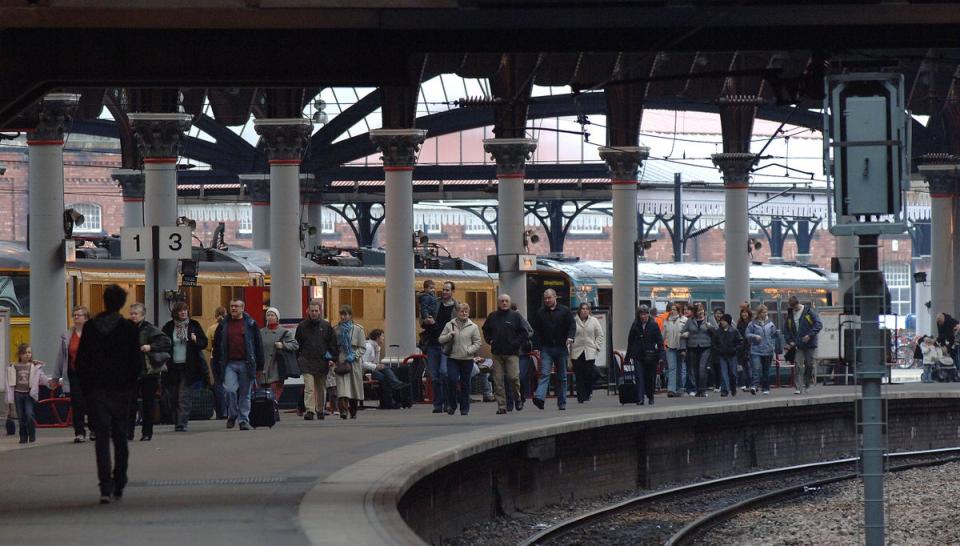 Passengers walk along the platform after alighting from a train at York station (Archive/PA) (PA Archive)