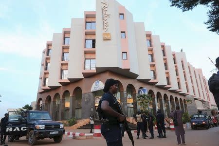 A Malian police officer stands guard in front of the Radisson hotel in Bamako, Mali, in this November 20, 2015 file photo. REUTERS/Joe Penney/Files