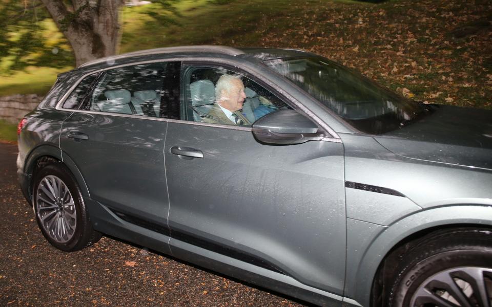 Pictured: The King drives the Queen to church in a new Electric Audi on Sunday