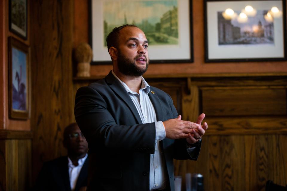 Joseph Alfonso, candidate for Michigan's Fourth Congressional District, speaks to potential voters during a meet and greet Thursday, June 29, 2023, at The Curragh in downtown Holland.