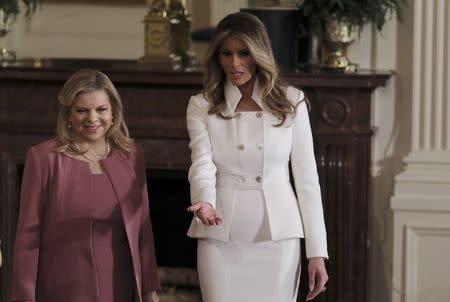 U.S. first lady Melania Trump (R) leads the way for Sara Netanyahu (L) prior to a joint news conference between their husbands, President Donald Trump and Israeli Prime Minister Benjamin Netanyahu, at the White House in Washington, U.S., February 15, 2017. REUTERS/Carlos Barria