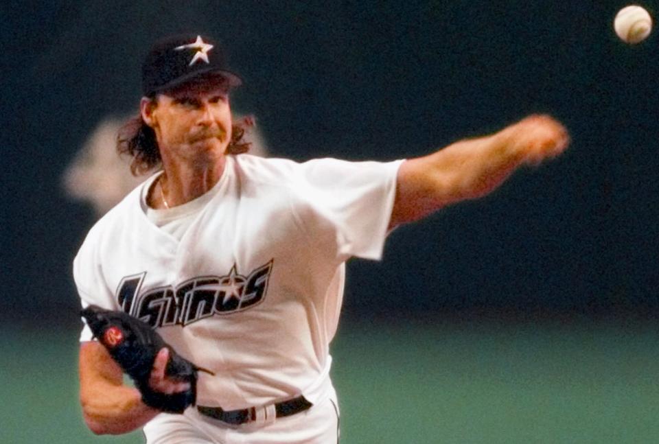 Houston Astros Randy Johnson delivers the first pitch of game one of the National League division playoffs between the San Diego Padres and the Astros in Houston, Tuesday, Sept. 29, 1998. (AP Photo/David J. Phillip)