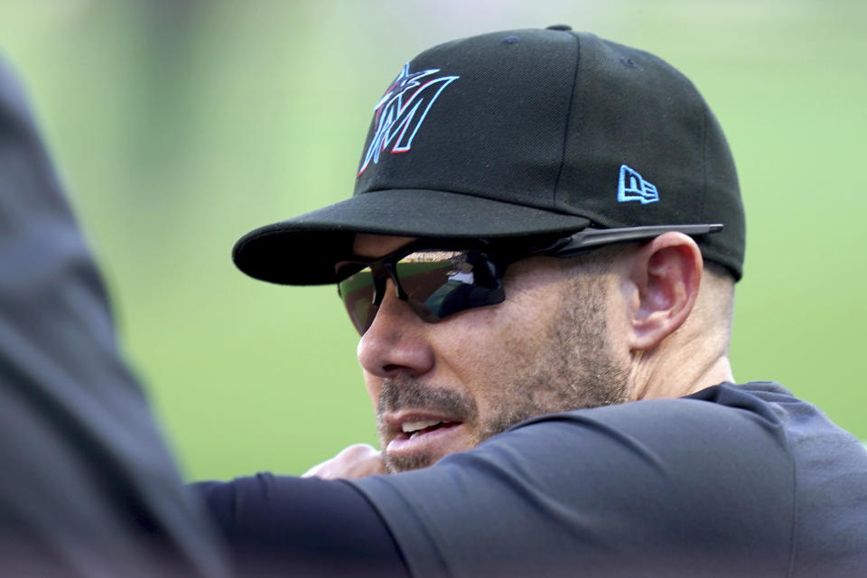 Miami Marlins manager Skip Schumaker stands in the dugout during the fifth inning of a baseball game against the Pittsburgh Pirates in Pittsburgh, Sunday, Oct. 1, 2023. (AP Photo/Matt Freed)