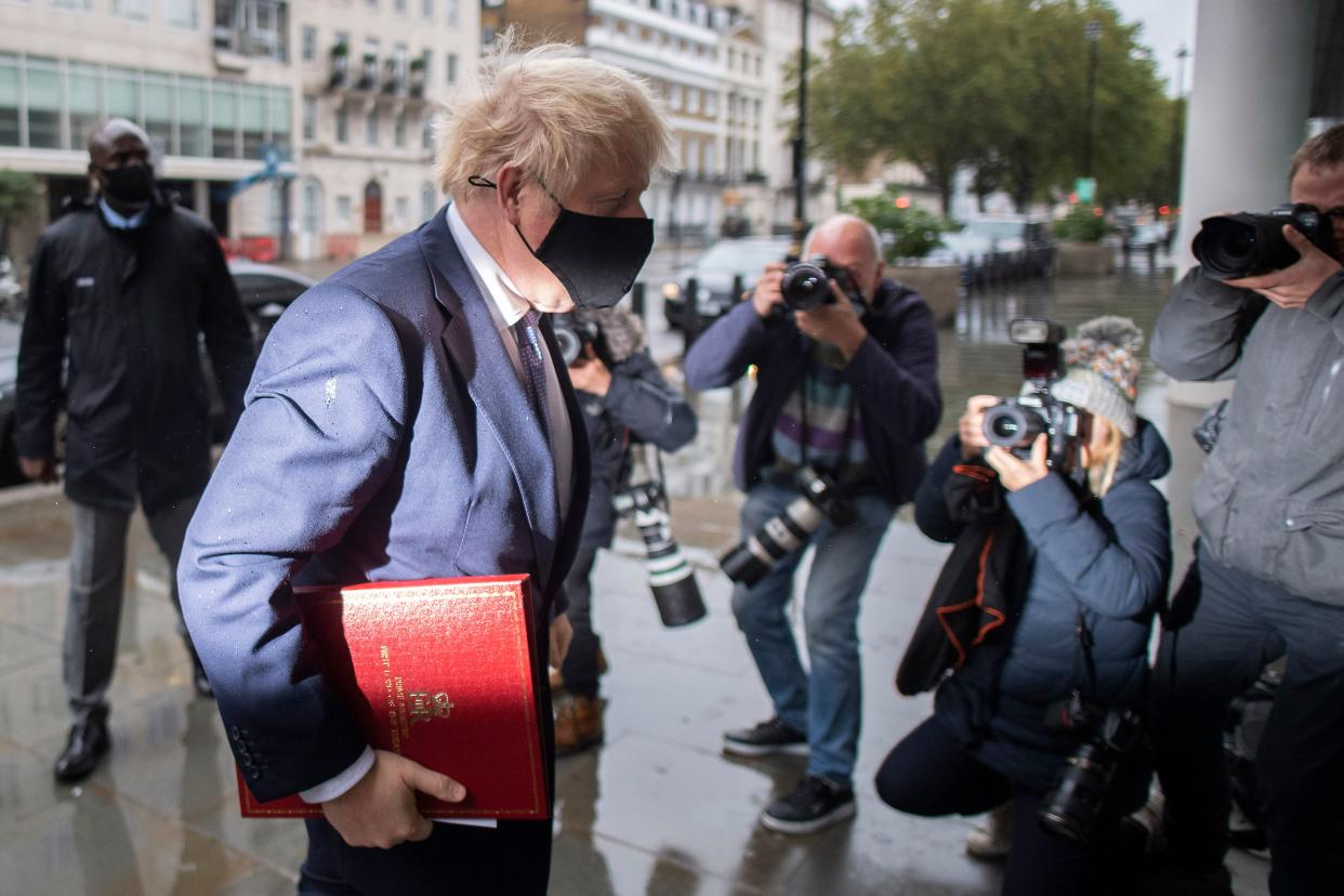 Britain's Prime Minister Boris Johnson wears a protective face covering as he arrives at the BBC in central London on October 4, 2020, to take part in the BBC political programme The Andrew Marr Show. - British Prime Minister Boris Johnson and EU chief Ursula von der Leyen on Saturday asked their negotiators to "work intensively" to overcome differences to secure a post-Brexit free trade deal. (Photo by JUSTIN TALLIS / AFP) (Photo by JUSTIN TALLIS/AFP via Getty Images)