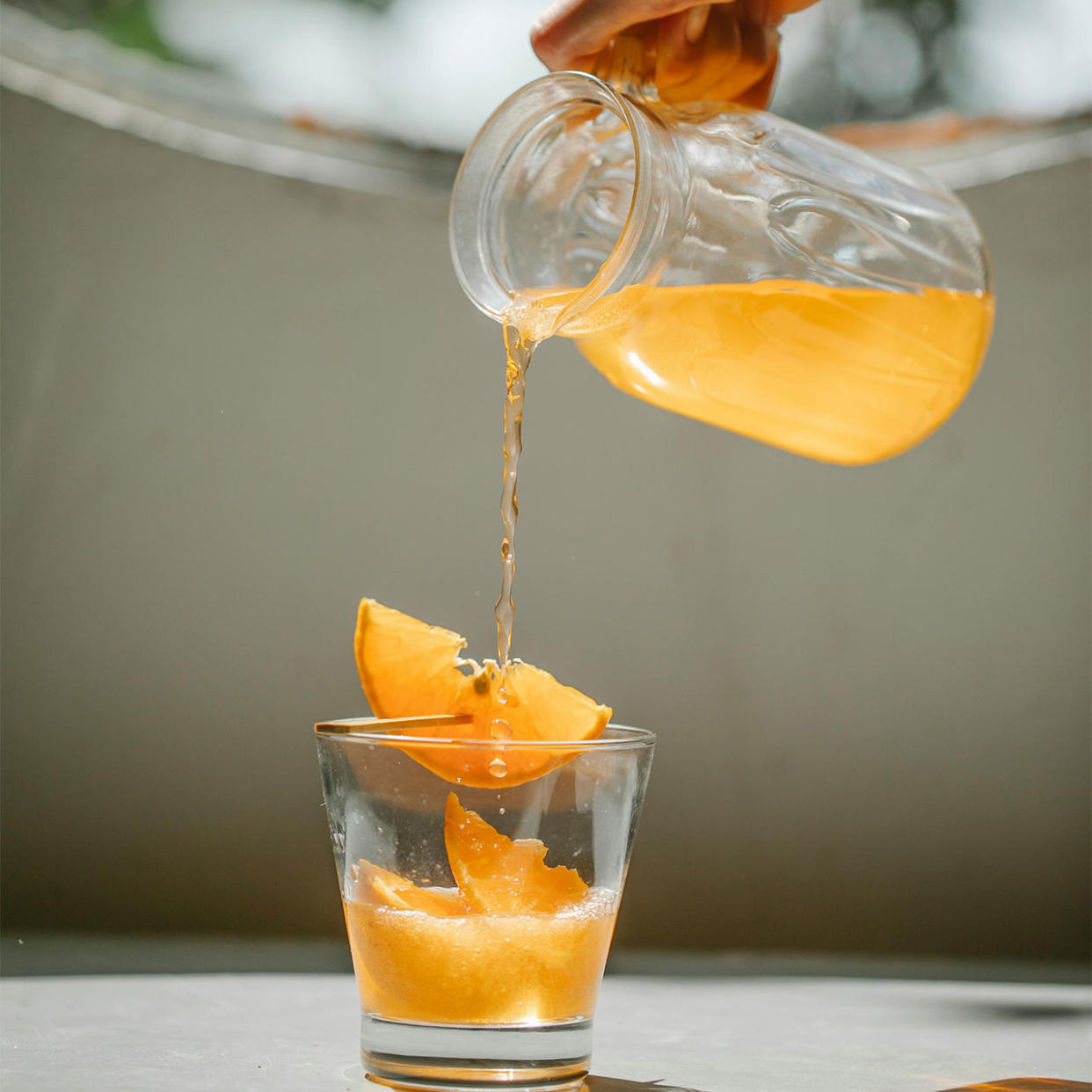 pouring juice from a pitcher