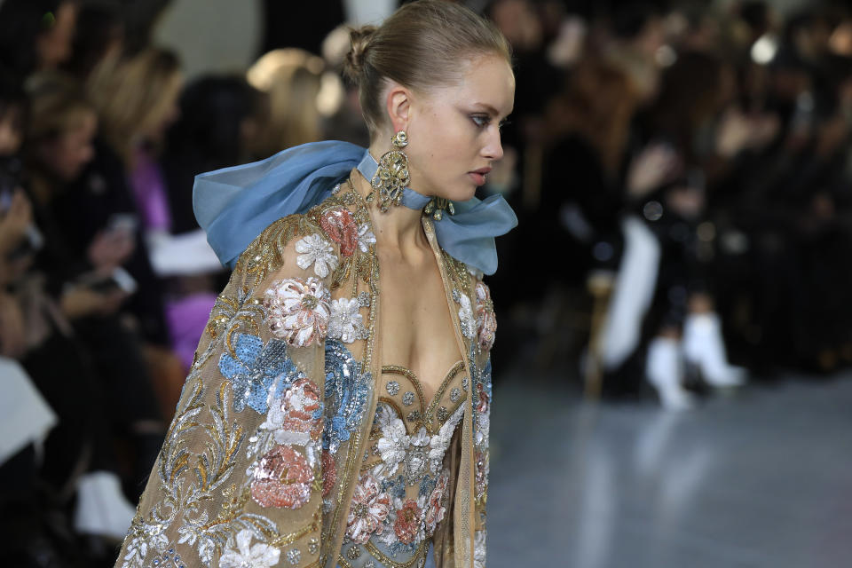 A model wears a creation for the Elie Saab Haute Couture Spring/Summer 2020 fashion collection presented Wednesday Jan. 22, 2020 in Paris. (AP Photo/Michel Euler)