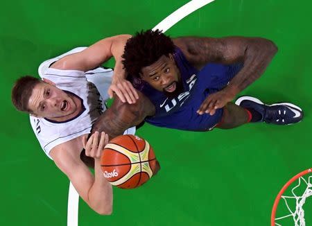 2016 Rio Olympics - Basketball - Final - Men's Gold Medal Game Serbia v USA - Carioca Arena 1 - Rio de Janeiro, Brazil - 21/8/2016. Vladimir Stimac (SRB) of Serbia (L) and Deandre Jordan (USA) of the USA compete. REUTERS/Mark Ralston/Pool