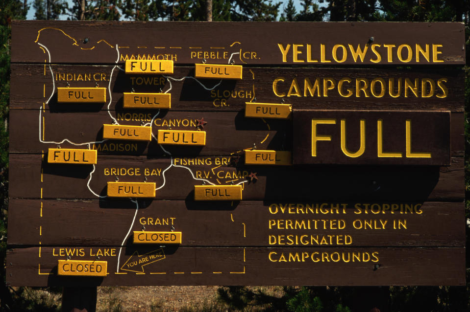 The Yellowstone Campground sign indicating all campgrounds are full at the entrance to Yellowstone National Park, Wyoming. (Photo: Getty Images)