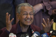In this Saturday, Feb. 22, 2020, photo, Malaysian Prime Minister Mahathir Mohamad, gesture as he speaks during a press conference in Putrajaya, Malaysia. Malaysian Prime Minister Mahathir Mohamad, has tendered his resignation to the king, his office reported Monday. (AP Photo/Vincent Thian)
