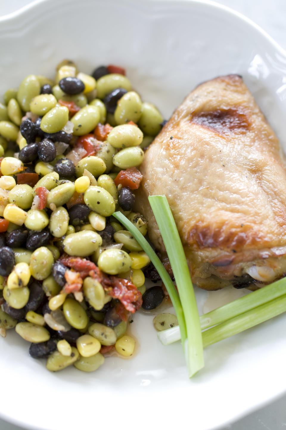 This Sept. 9, 2013 photo shows sweet tea brined grilled chicken in Concord, N.H. Brining infuses both moisture and flavor into lean cuts of meat, such as pork, poultry and fish. (AP Photo/Matthew Mead)