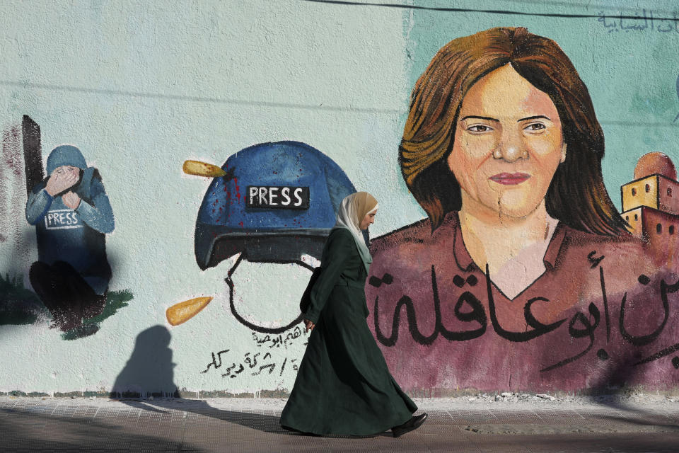 FILE - A mural of slain of Al Jazeera journalist Shireen Abu Akleh who was shot dead during an Israeli military raid in the West Bank town of Jenin, adorns a wall in Gaza City, May 15, 2022.The Israeli military acknowledged for the first time on Monday, Sept. 5, 2022, that one of its soldiers likely killed veteran Al Jazeera journalist Shireen Abu Akleh in May, saying its own investigation shows she was shot by mistake and that no one will face punishment. (AP Photo/Adel Hana, File)