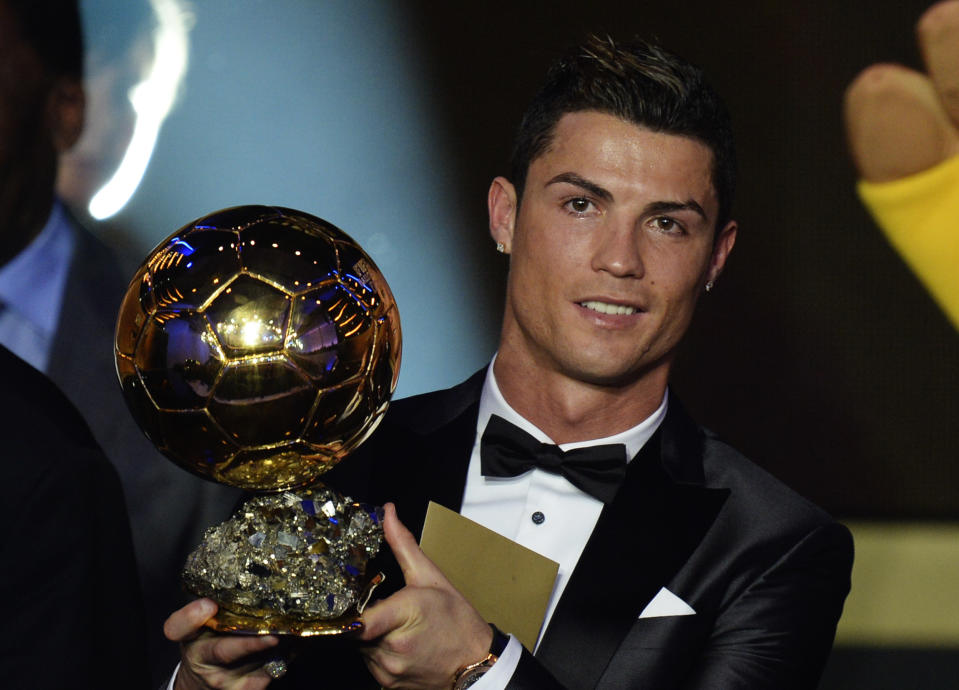 Cristiano Ronaldo of Portugal is awarded the prize for the FIFA Men's soccer player of the year 2013 at the FIFA Ballon d'Or 2013 gala at the Kongresshaus in Zurich, Switzerland, Monday, Jan. 13, 2014. (AP Photo/Keystone, Steffen Schmidt)