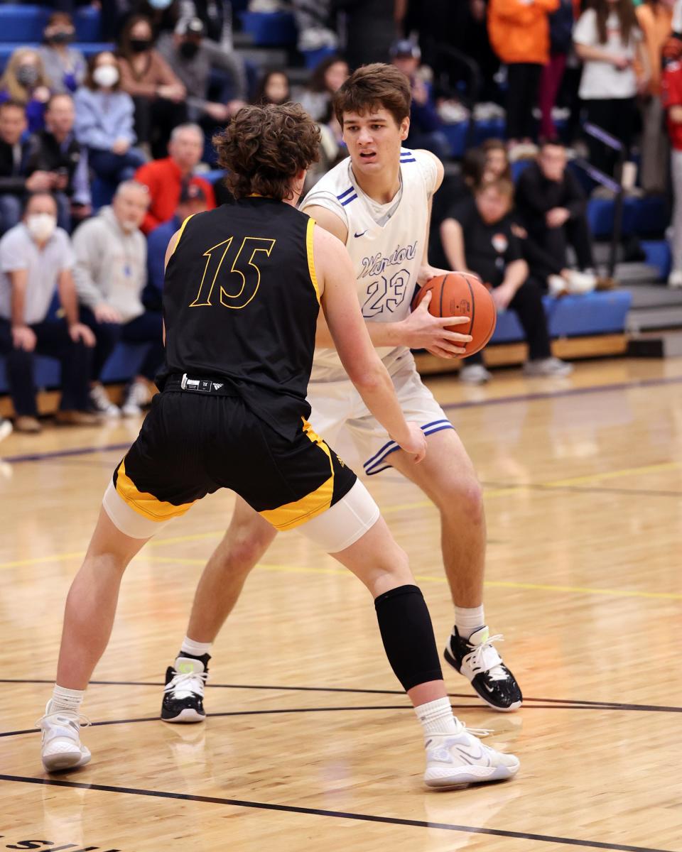 Mariemont forward Ethan Malafa looks to get around Taylor forward Dylan Lanham in the game between Taylor and Mariemont high school Jan. 14, 2022.