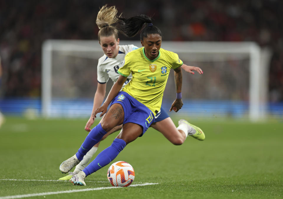 Brazil's Kerolin shields the ball from England's Ella Toone during the Women's Finalissima soccer match between England and Brazil at Wembley stadium in London, Thursday, April 6, 2023. (AP Photo/Ian Walton)