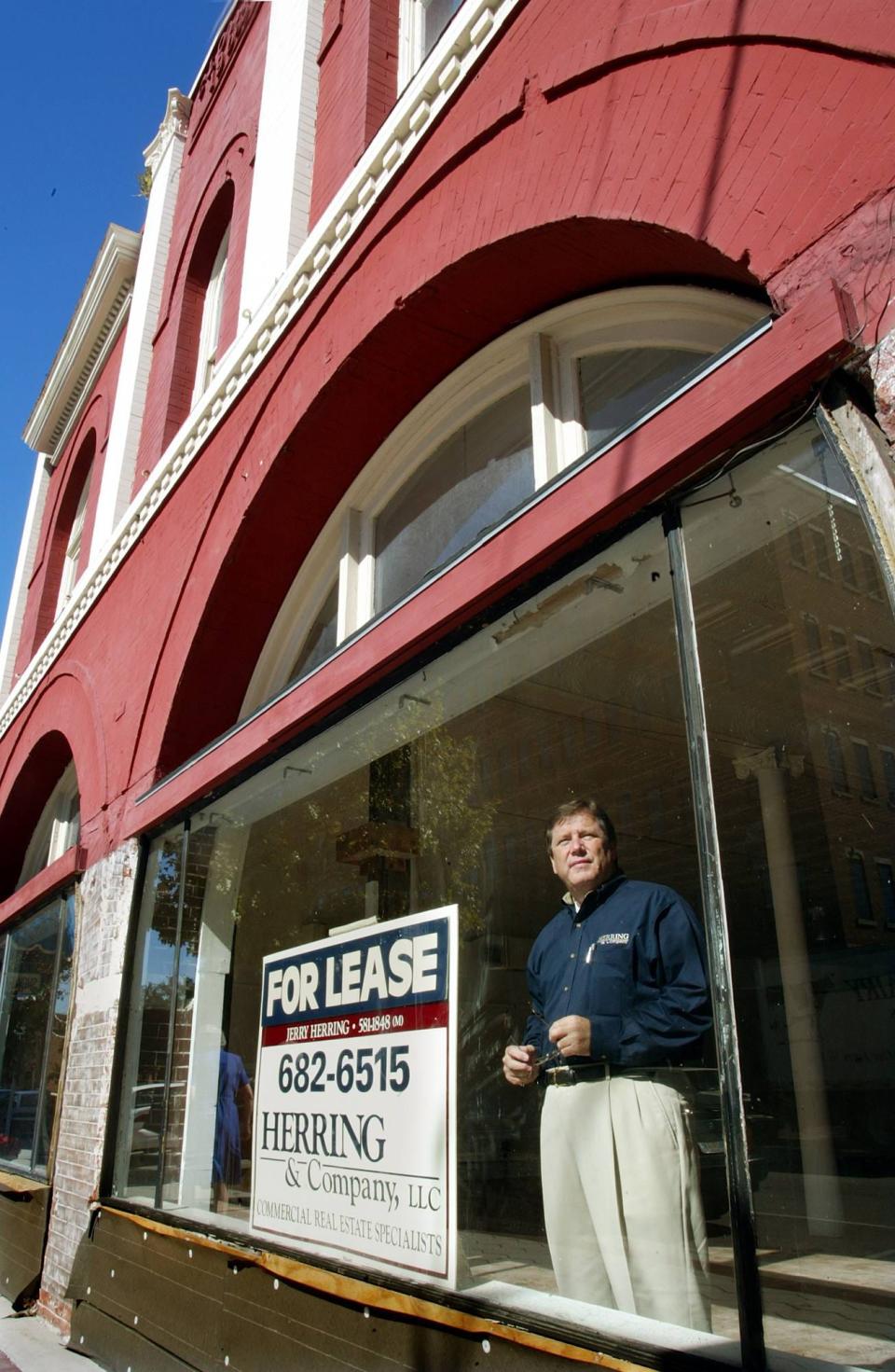Jerry Herring, President of Herring & Company, LLC, looks out the first floor of the Clonts Building in downtown Lakeland in 2002.He had recently purchased the building, built in 1903, with plans to renovate it for retail and office space. Herring, who bought and renovated many properties downtown, died recently at age 75.