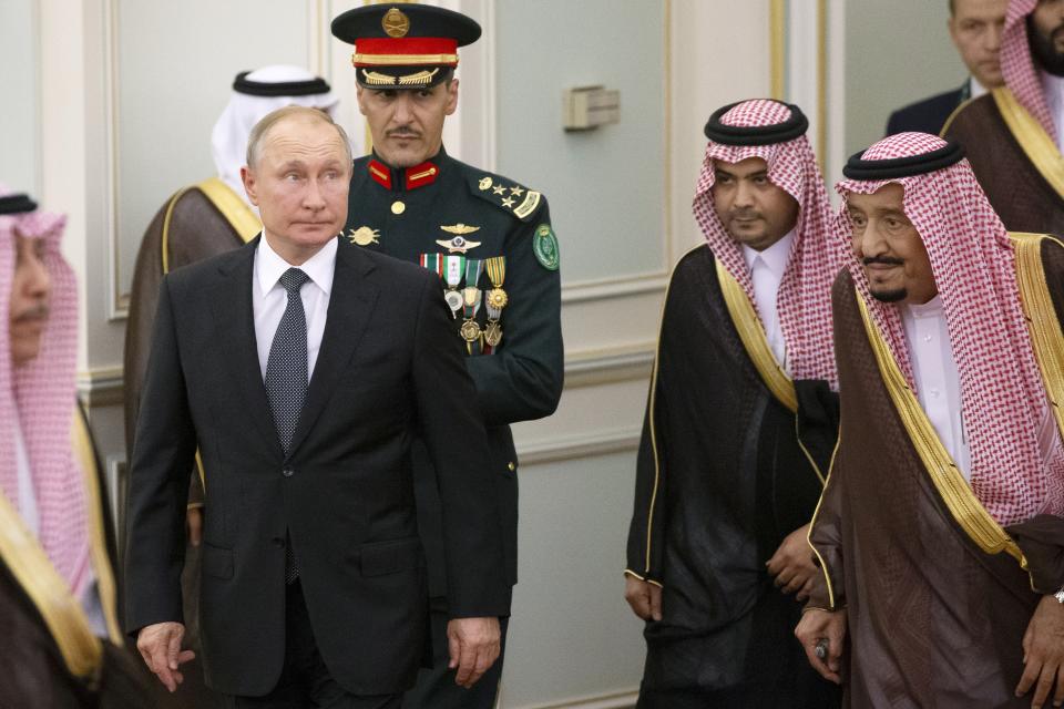 FILE - Russian President Vladimir Putin, center left, and Saudi Arabia's King Salman, right, attend the official welcome ceremony in Riyadh, Saudi Arabia, on Oct. 14, 2019. As part of its efforts to expand its global clout, Russia has moved to bolster ties with Saudi Arabia. (AP Photo/Alexander Zemlianichenko, Pool, File)