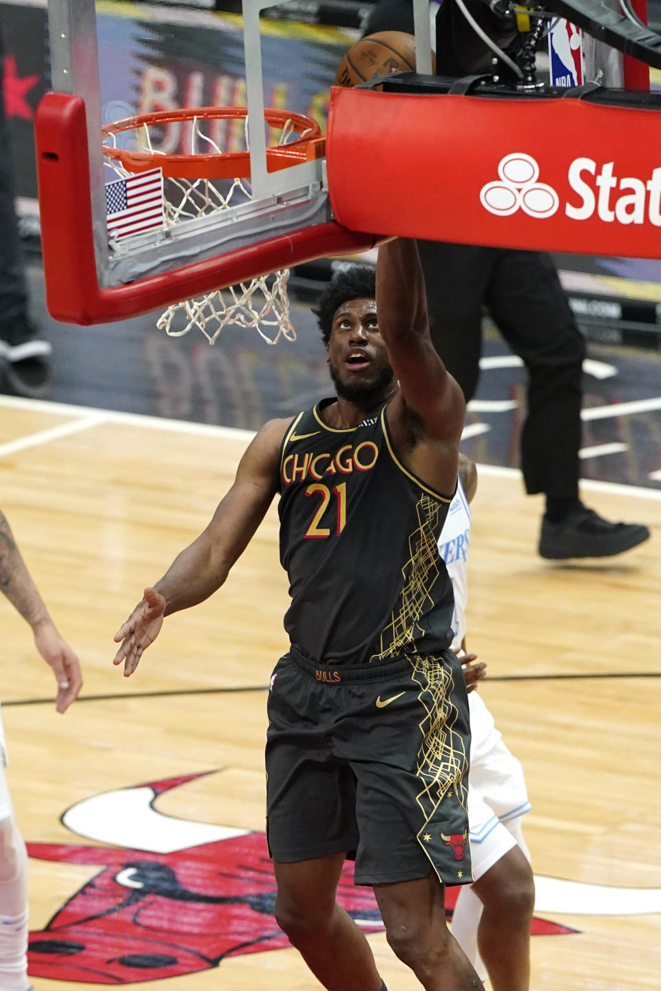 Chicago Bulls forward Thaddeus Young drives to the basket during the first half of the team's NBA basketball game against the Los Angeles Lakers in Chicago, Saturday, Jan. 23, 2021. (AP Photo/Nam Y. Huh)