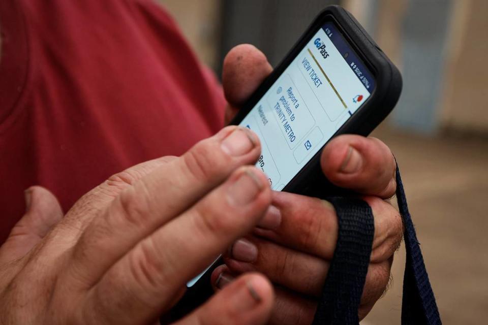 Billy Patton finds his bus pass while waiting to commute home after a day of working at Lighthouse for the Blind on Wednesday, May 22, 2024.