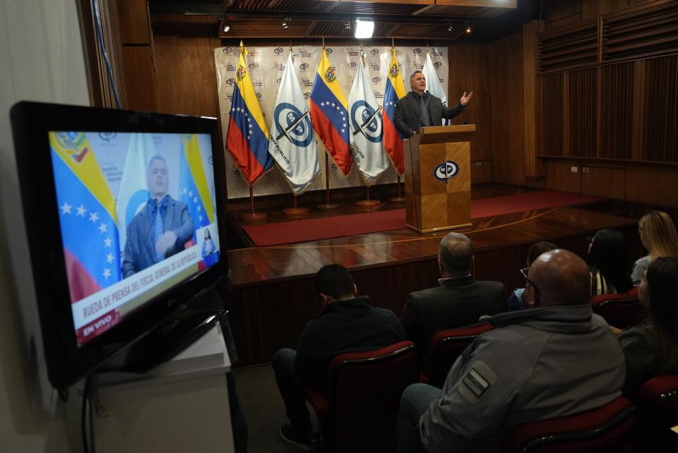 Venezuelan Attorney General Tarek William Saab announces the arrest order for three exiled former lawmakers in Caracas, Venezuela, Monday, Jan. 9, 2023. Saab announced that prosecutors had ordered the arrest of Dinorah Figuera and her two deputies on charges of treason, money laundering and impersonating public officials. Figuera lead an all-female team that was selected last week by fellow opposition politicians to lead the National Assembly voted into office in 2015. (AP Photo/Ariana Cubillos)