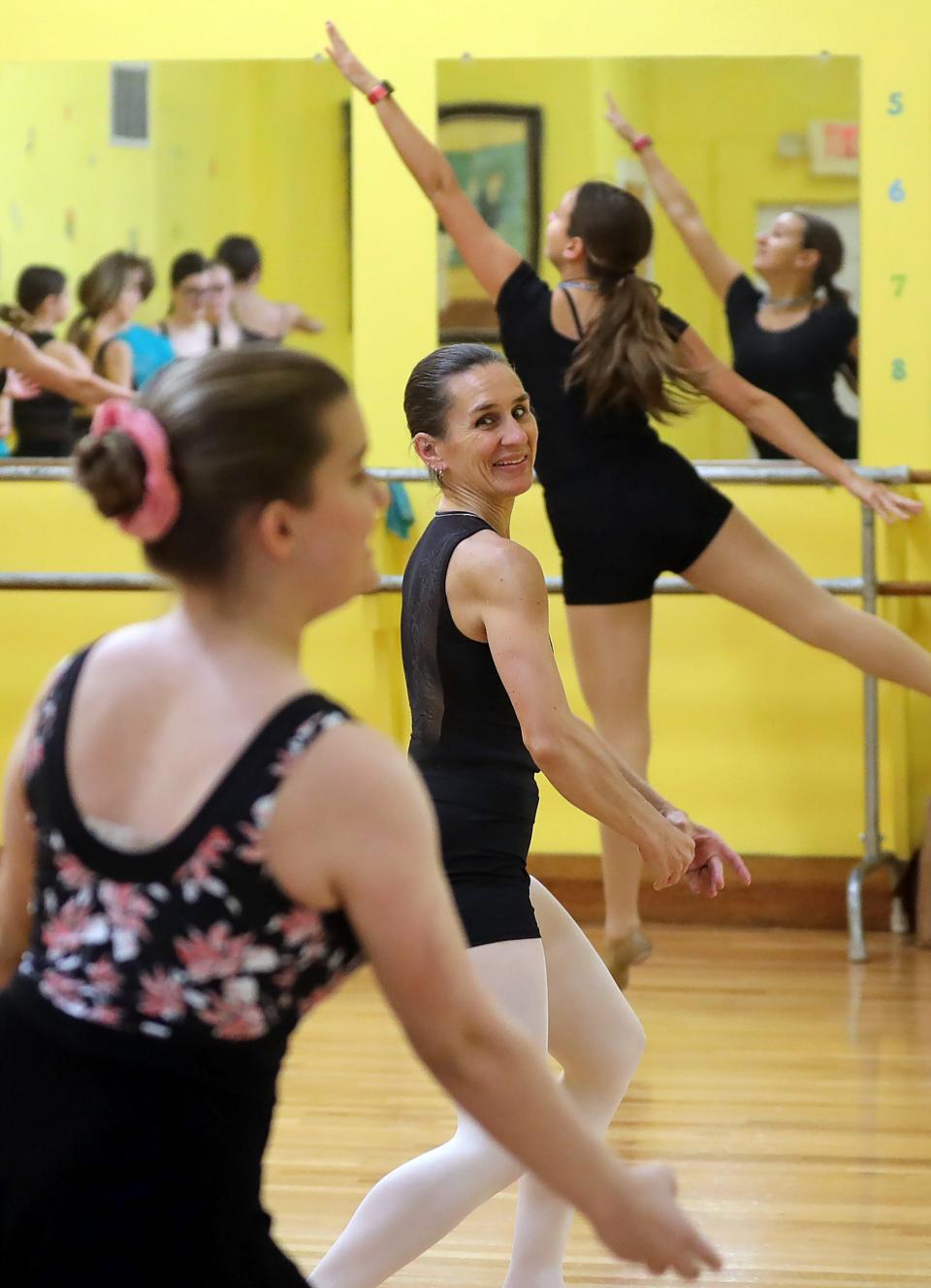 Veronica Neubert, center, watches her daughter Ali as they practice a number during class Monday at McCardle’s Dance Studio.