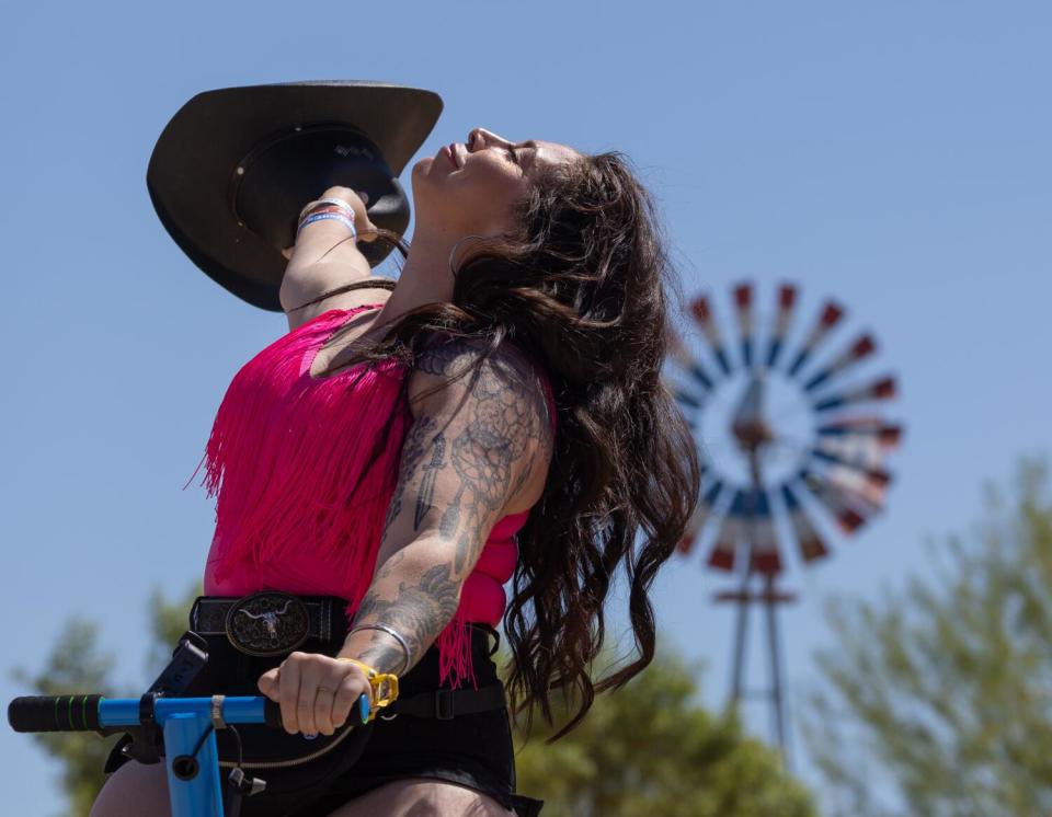 Miranda Marquez, of Redondo Beach, enjoys riding on the the Global Inheritance's Energy SeeSaw at Stagecoach.