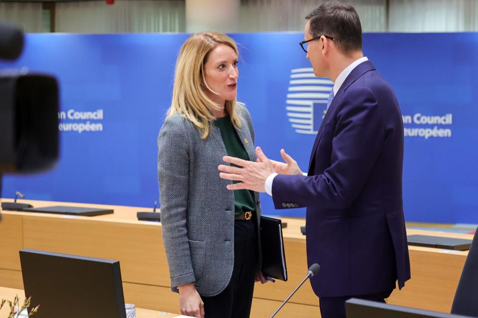 European Parliament President Roberta Metsola and Poland's Prime Minister Mateusz Morawiecki talk before the an extraordinary meeting of EU leaders to discuss Ukraine, energy and food security in Brussels, Monday, May 30, 2022.