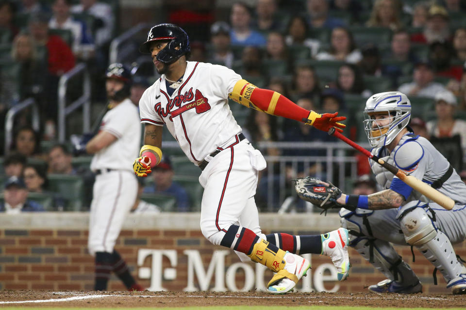 Atlanta Braves' Ronald Acuna Jr. watches his single during the third inning of the team's baseball game against the New York Mets, Saturday, Oct. 1, 2022, in Atlanta. (AP Photo/Brett Davis)