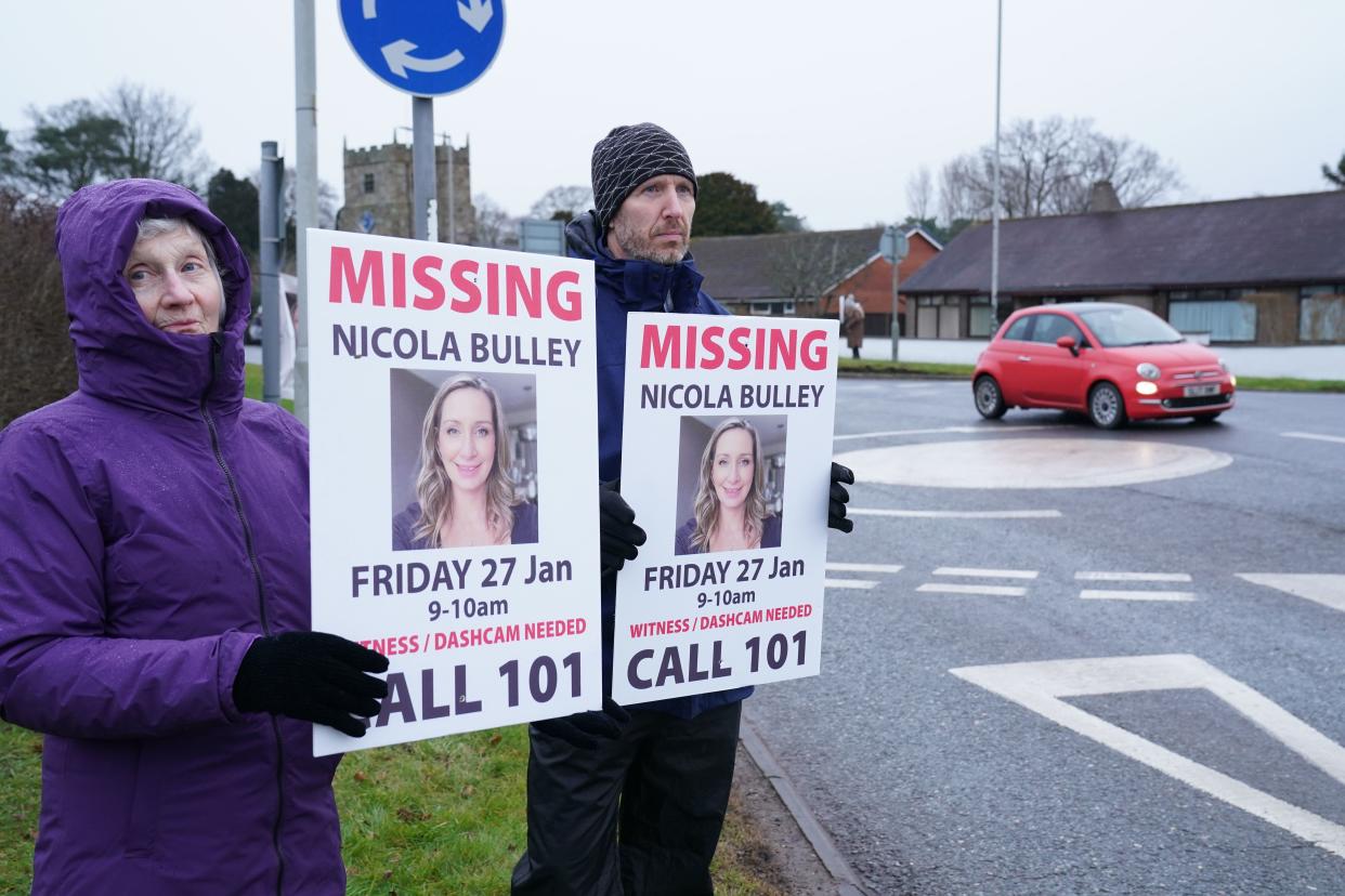 Friends of Nicola Bulley hold appeal posters along the main road in the village of St Michael’s on Wyre (Owen Humphreys/PA) (PA Wire)