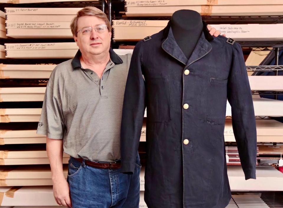 Ray Richey of the Texas Civil War Museum stands with a coat worn by Gen. Ulysses S. Grant on Wednesday, January 30, 2013. The coat and some swords are being added to the collection.