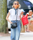 <p>Naomi Watts grabs some gardening gear on Thursday during a shopping trip in The Hamptons, New York.</p>