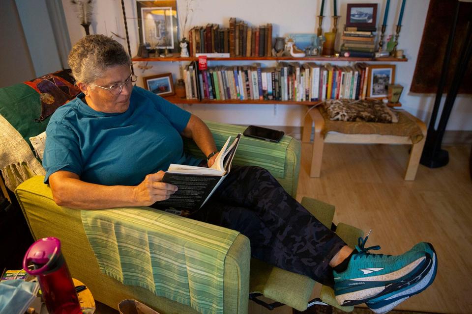 Rachel Matthews reads in her home in December. During the pandemic, Matthews started participating in a Zoom book group at the Lake Travis Community Library that meets every Friday.