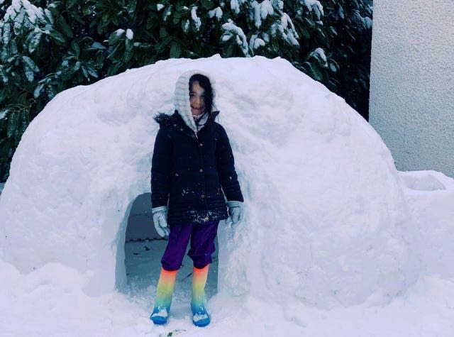 Sienna, five, who has built an igloo with her mother Nicola Black in their back garden in Aberdeen